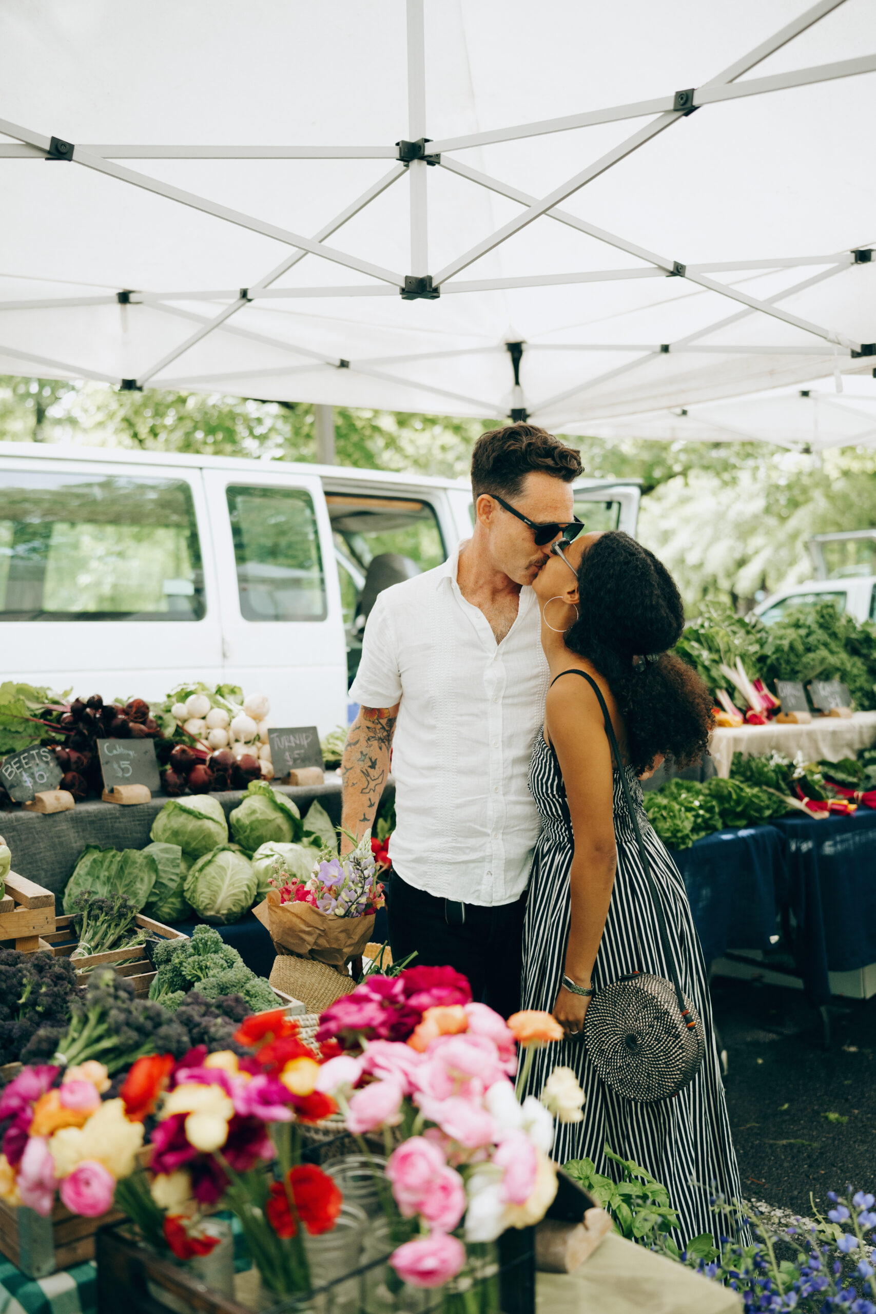 Engagement session at a farmers market where the couple met