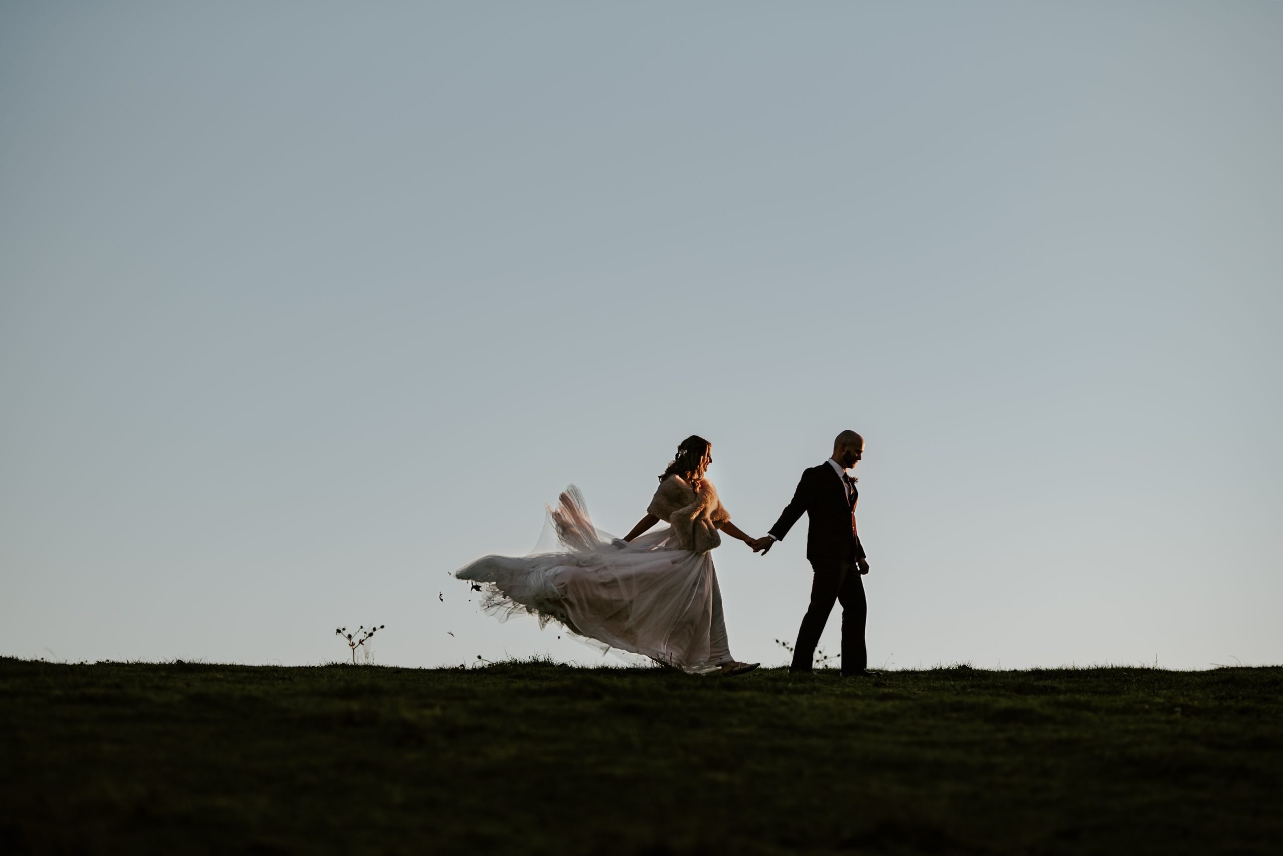 Mountain top bride and groom
Bride and groom kissing with sweeping mountain views at sunset, Asheville fine art wedding photographer capturing epic landscapes