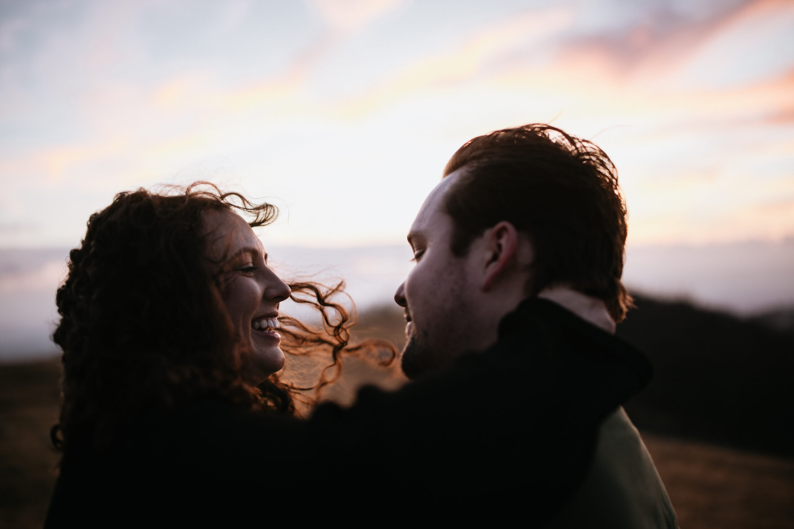 Mountain top engagement
Engaged couple embracing at sunset on a mountain top near Asheville, adventurous engagement session with cinematic tones.