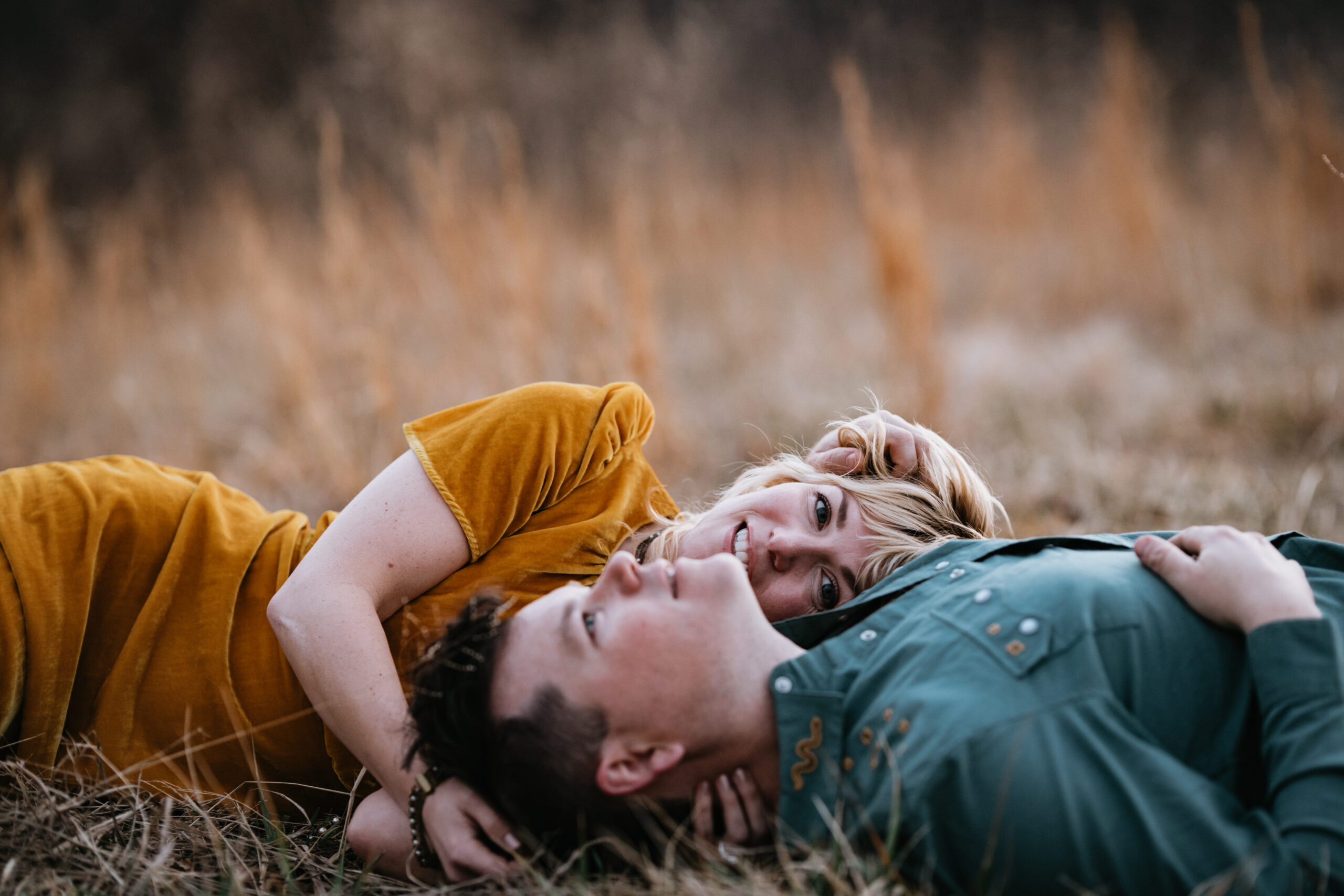 Engagement session (field)
Engaged couple lying in a golden field during sunset, intimate engagement session in North Carolina captured on film and digital.