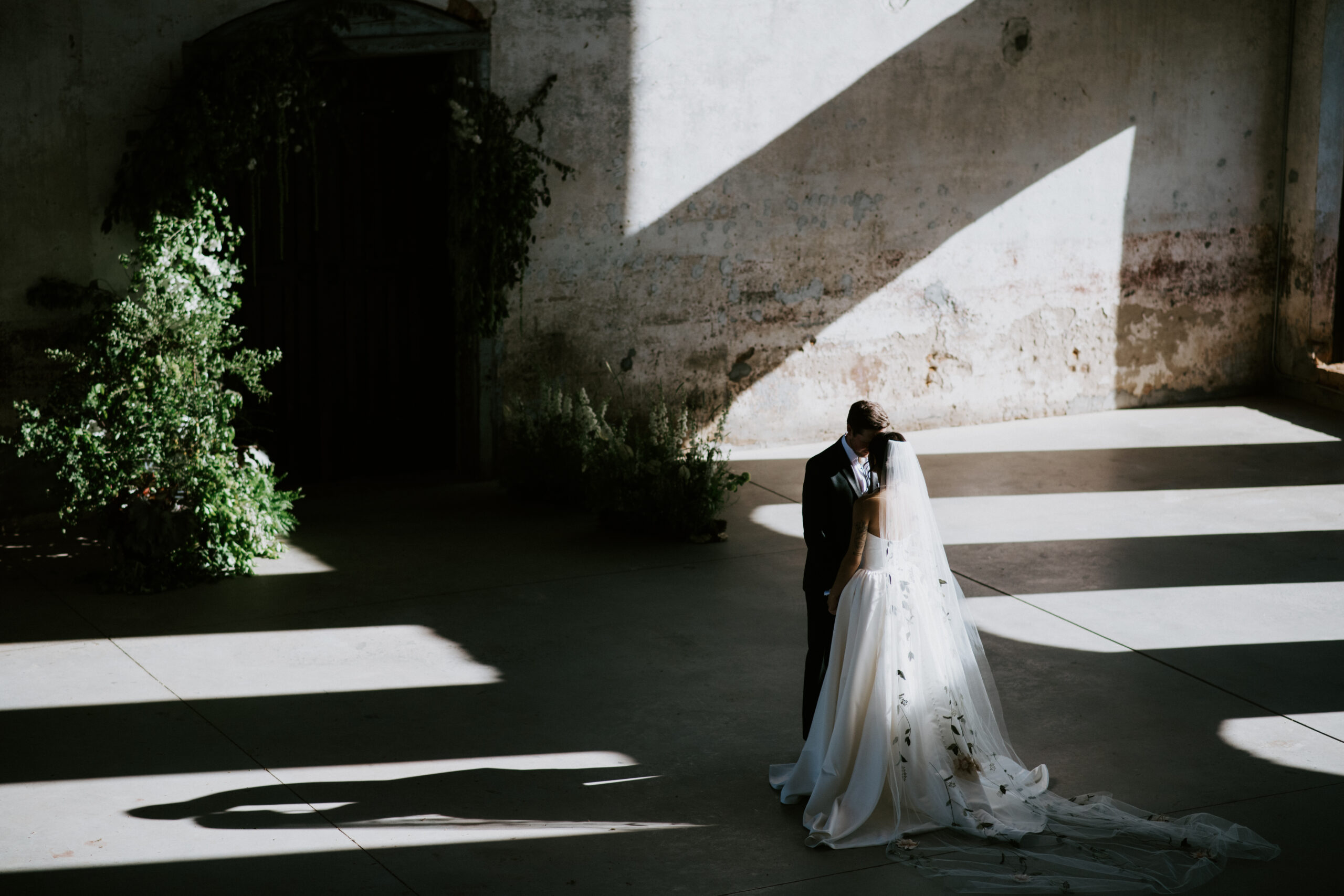 Providence Cotton Mill
Bride and groom embracing under dramatic light at Providence Cotton Mill, luxury wedding venue near Asheville captured in fine art style.